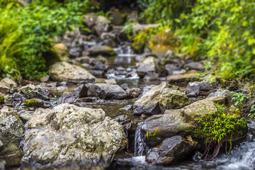 A small blue river flows in the mountainous country of Georgia.