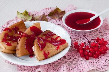 Pancakes with jam from berries of viburnum