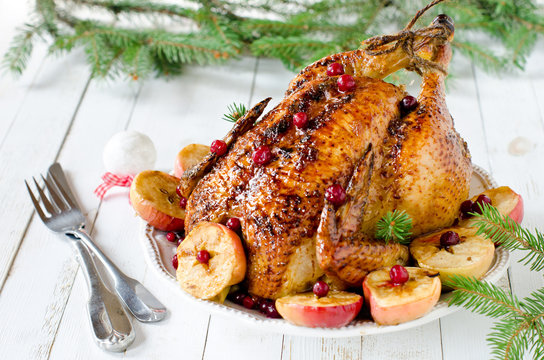 Christmas chicken, turkey baked with cranberries and apples