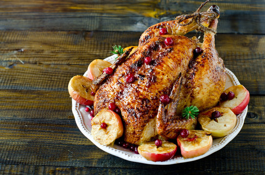 Christmas chicken, turkey baked with cranberries and apples