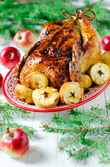 Fototapeta na wymiar Traditional Christmas chicken, turkey baked with apples