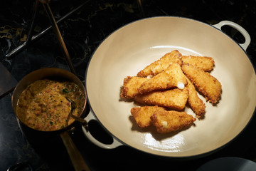 Fried chicken nuggets in cooking pan