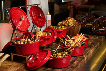 Big dish set with boiled carrots, baked potatoes, fried fish