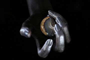 Silver jewelry on a dark background