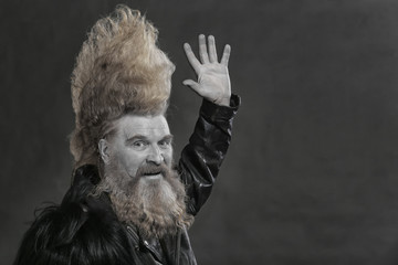 Portrait of a cheerful man with long hair and beard