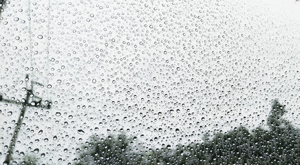 Rain drops on car window background