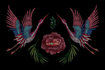 Obraz premium flowers cherry blossom and crane, east. traditional stylish fashionable embroidered embroidery on a black background. sketch for printing on fabric, bag, clothes, accessories and design. trend vector