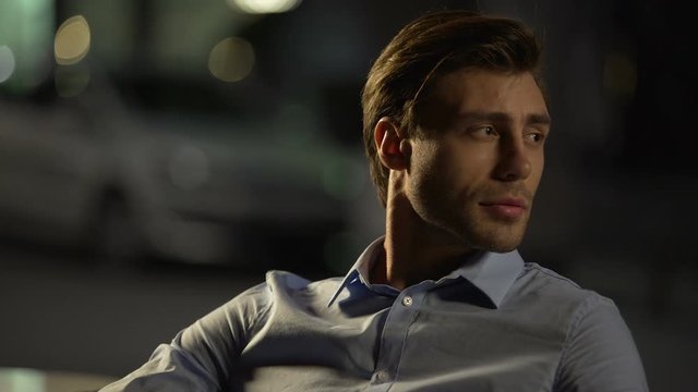 Attractive male sitting in restaurant and looking for one night woman, pick-up
