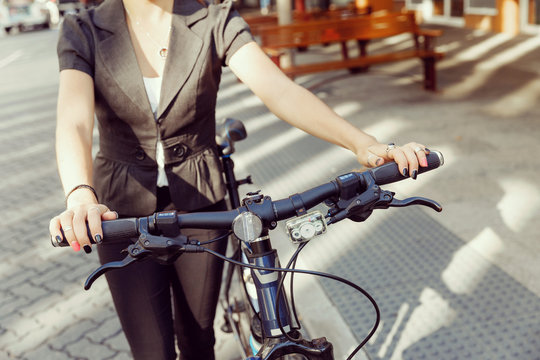 Young woman commuting on bicycle