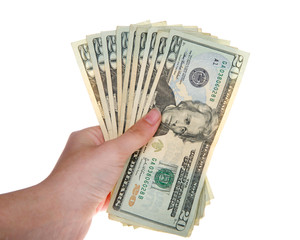 Young female hand holding stack of twenty dollar bills fanned out isolated on white background.