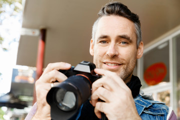 Male photographer taking picture