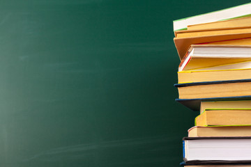 Books on Desk, Chalkboard Background