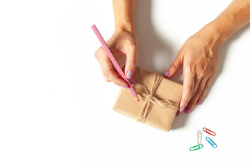 Woman's hands wrapping a gift
