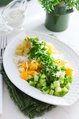 Salad with cabbage, potatoes, cucumber and egg, selective focus
