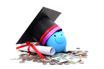 Congratulation concept: Piggy bank with a graduation hat With the concept of scholarship funding