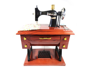 Fototapeta na wymiar Sewing machine. Souvenir toy. Photo of a toy sewing machine.