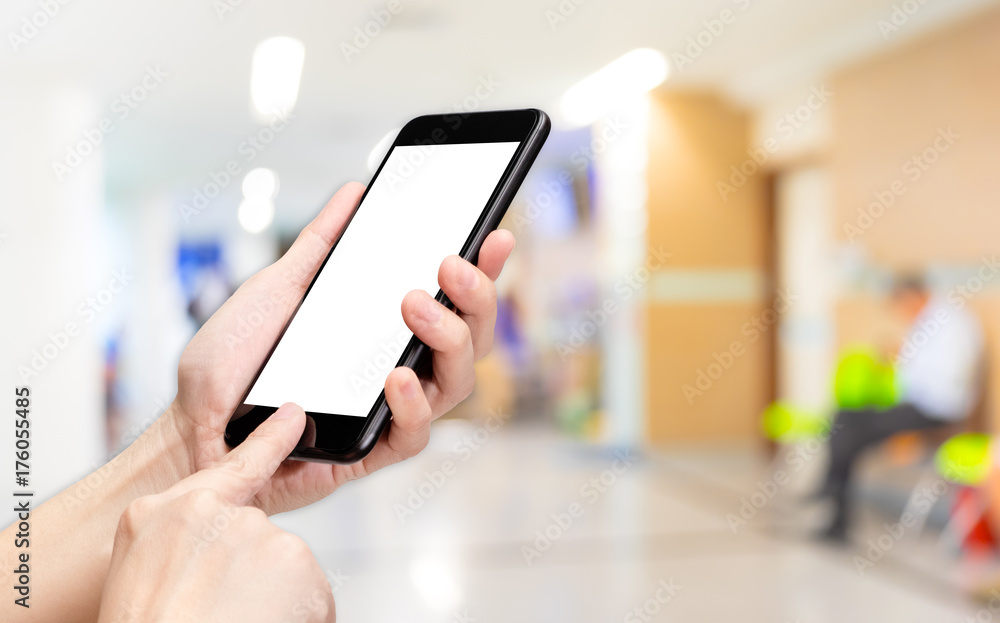 Poster Hand click mobile phone with blur patient at hospital background bokeh light,White screen mock up template for adding your design or your text.