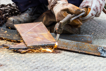 Manual  Worker cut steel with gas -  Plasma Cutting Machine on Steel Plate