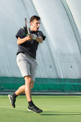 A professional tennis player plays tennis on the court. Strike and real emotion