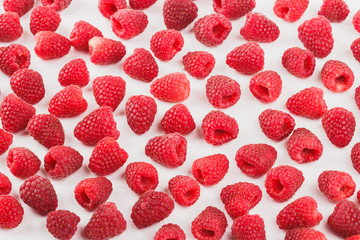 Background from raspberries, isolated on white