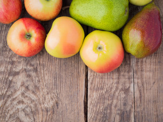 fruit set of pears and apples on wooden rustic table antique. The view from top, empty space for text.