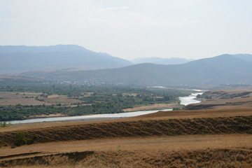 Obraz premium Beautiful Georgian landscape with mountains and river