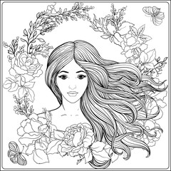 Fototapeta premium Young beautiful girl with long hair in rich decorated floral pat