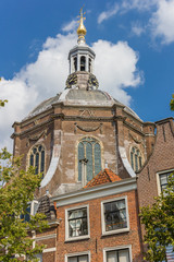 Fototapeta na wymiar House and tower of the Marekerk church in Leiden