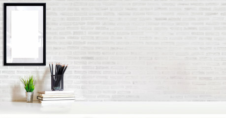 Loft workspace concept. Mock up white frame and stuff, minimal stuff on desk.