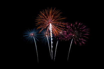 Beautiful Colorful New year fireworks over dark sky