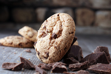 Chocolate cookies on wooden table. Chocolate chip cookies shot.