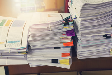 Business and finance concept of office working, Pile of unfinished documents on office desk, Stack of business paper