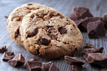Chocolate cookies on wooden table. Chocolate chip cookies shot.