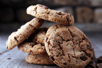 Chocolate cookies on wooden table. Chocolate chip cookies shot.