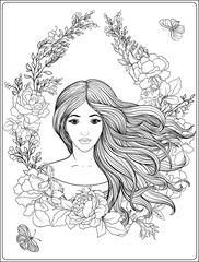Young beautiful girl with long hair in rich decorated floral pat