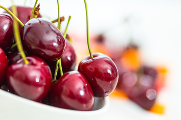 Fresh cherries in a bowl on the table