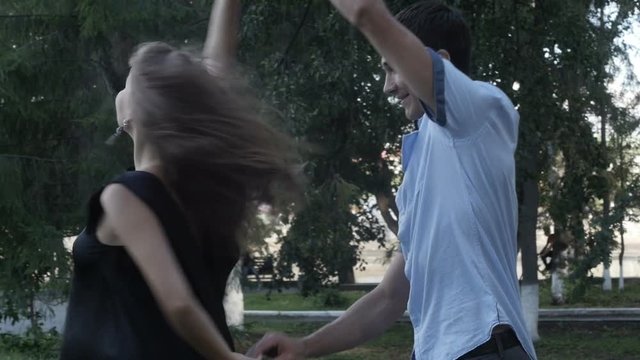 Future parents rest and dance in the park