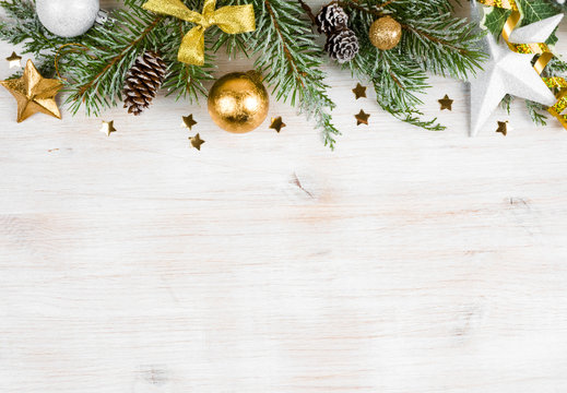 Christmas wooden background with frosted fir tree, view with copyspace