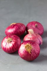 Red onion on the table.