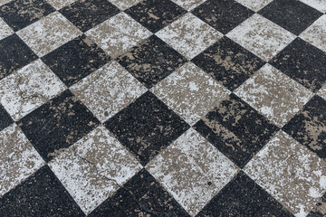 Grungy scratched and faded outdoor concrete chessboard background