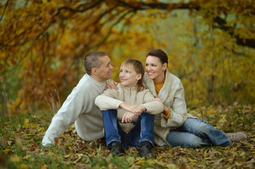 Happy family in the autumn park