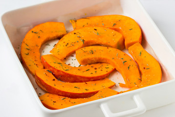 Raw Pieces of pumpkin on a tray.
