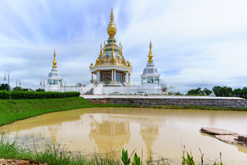 Magnificent Wat Thung Setthi (The Great Jewel Chedi of the three worlds) in beautiful day and reflection , Khon Kaen , Thailand