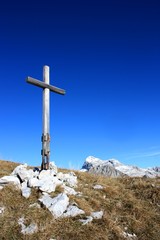 big cross in the front of the mountains
