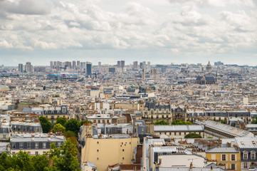 Paris roofs with a cloudy sky, France