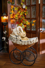 old teddy bears sitting in vintage baby carriage