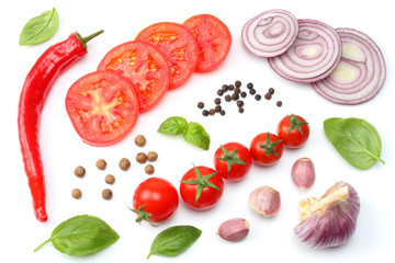 slice of tomato with chili pepper, garlic and parsley isolated on white background. top view