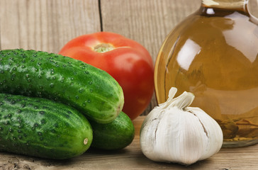vegetables and a bottle of oil, still life