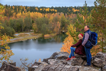 Family travelers looking at a mountain lake in Marble Canyon.