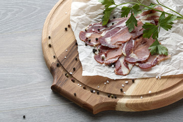 Spanish hamon ready for eat ovet the wooden background